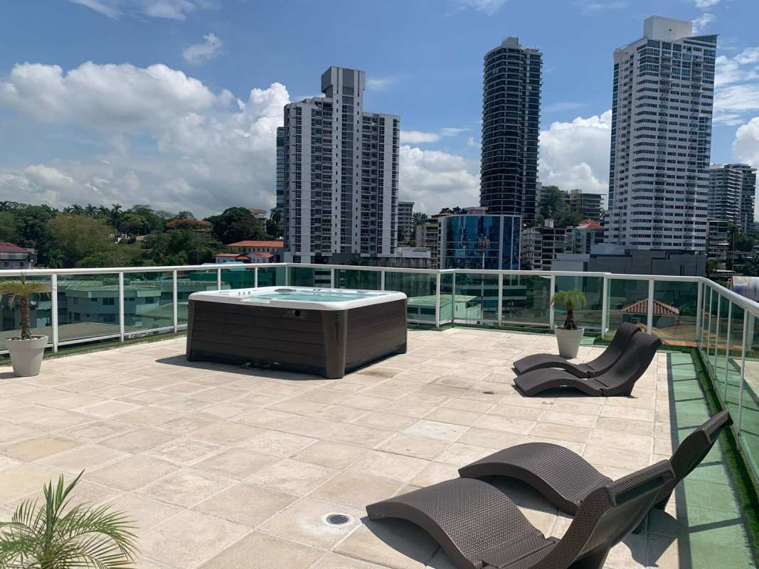 Unfurnished bright living room with sliding glass door to balcony and city view in PH Bela Vita Bella Vista Panama