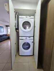 Spacious living room with balcony access and ocean views in El Palmar Residences vacation condo Panama