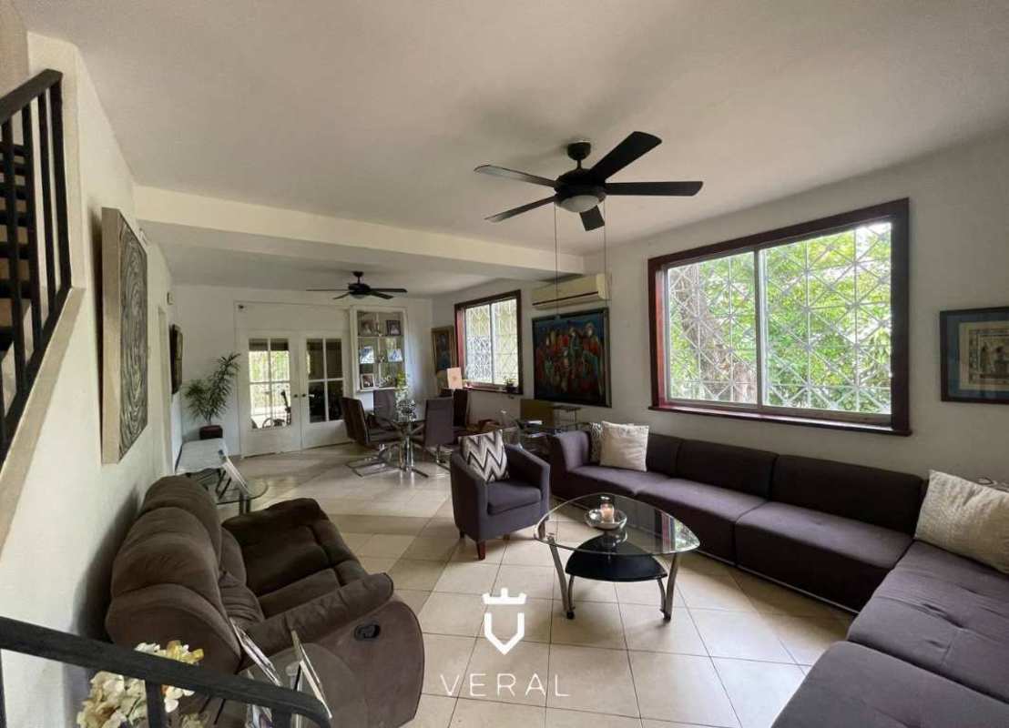 Bright living room with marble floors ceiling fans in spacious Panama house for sale