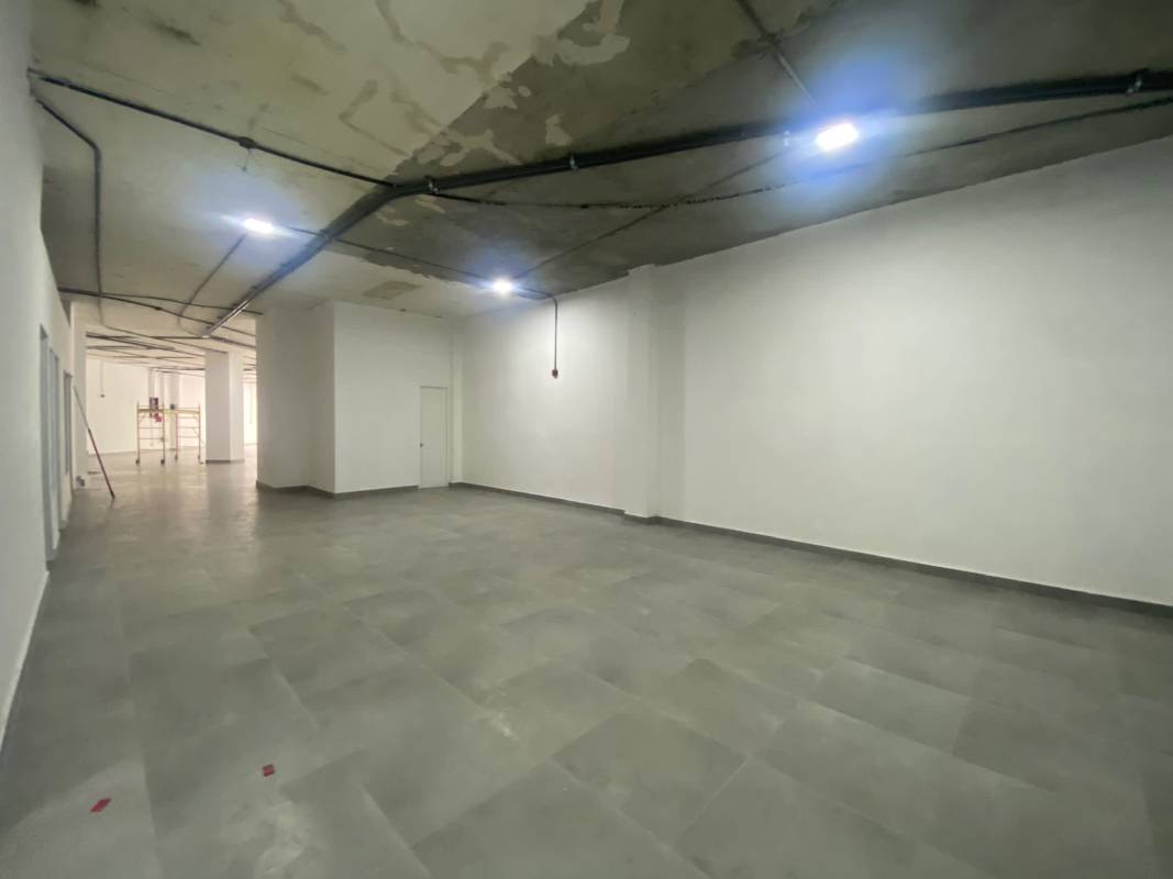 Wide empty ground floor space with tiled floors and exposed ceiling in Obarrio Panama