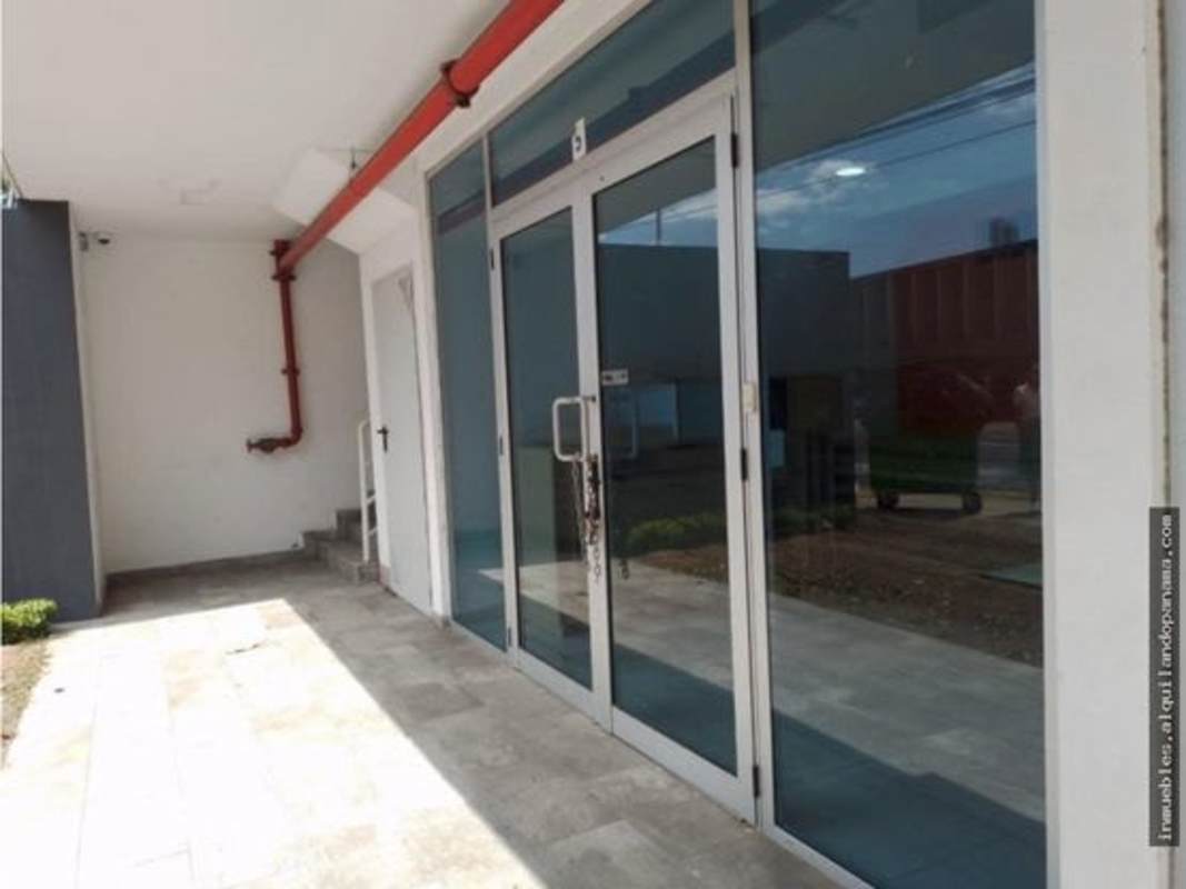 Street entrance with large glass doors at Signature Point Panama City