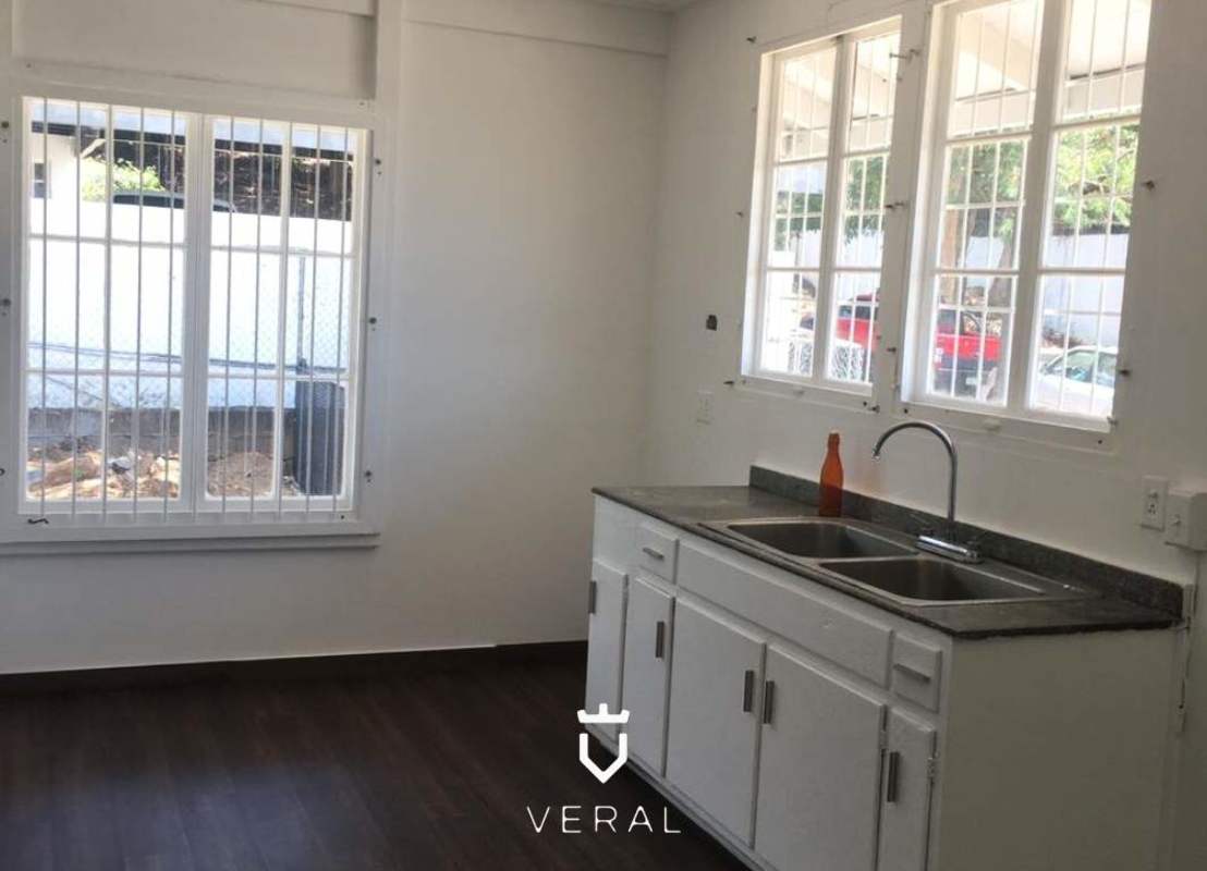 Empty bright bedroom with dark wood flooring and window Los Ríos Albrook Panama