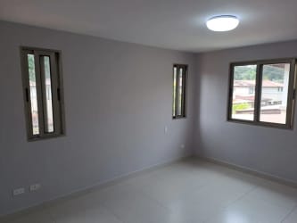 Bright bedroom with air conditioning, window, and closet PH Canal Walk Panama