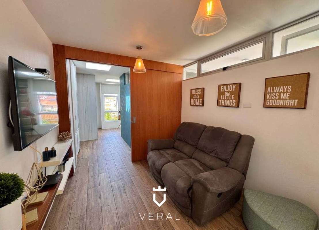 Modern kitchen with white backsplash and black cabinetry in Fuente del Fresno for sale