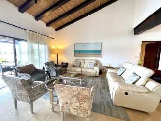 Spacious kitchen with granite countertops and wood cabinetry in luxury Panama beach villa