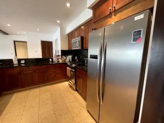 Master bedroom with ensuite and lagoon view terrace in luxury Buenaventura villa Panama