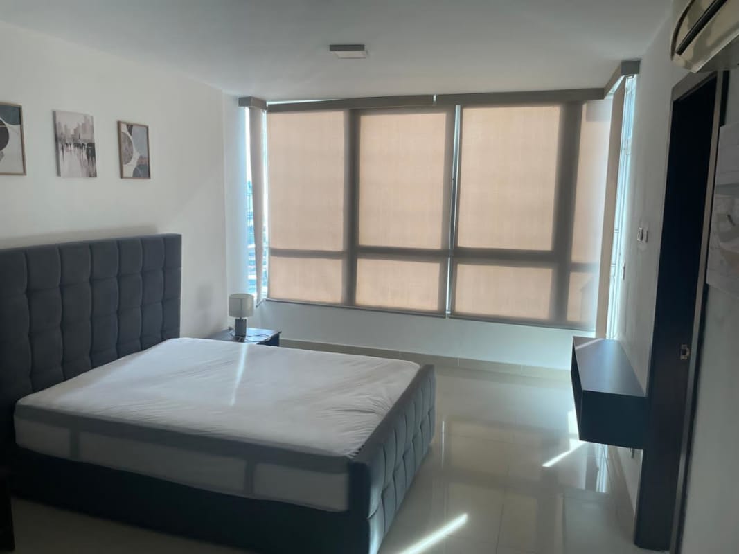 Minimalist bedroom tile flooring large windows blinds AC PH Top Tower Panama