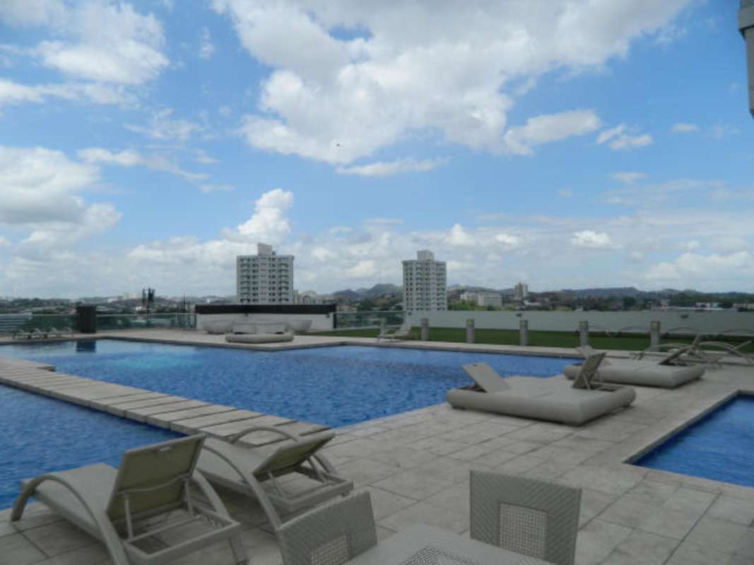 Rooftop pool with lounge chairs skyline views PH Top Tower Costa del Este Panama