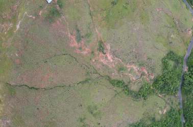 Aerial panorama of partly cleared land with trails and mountain views for sale San Carlos Panama