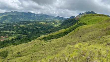 Lush green hills and valley nature view along highway available for development in San Carlos Panama