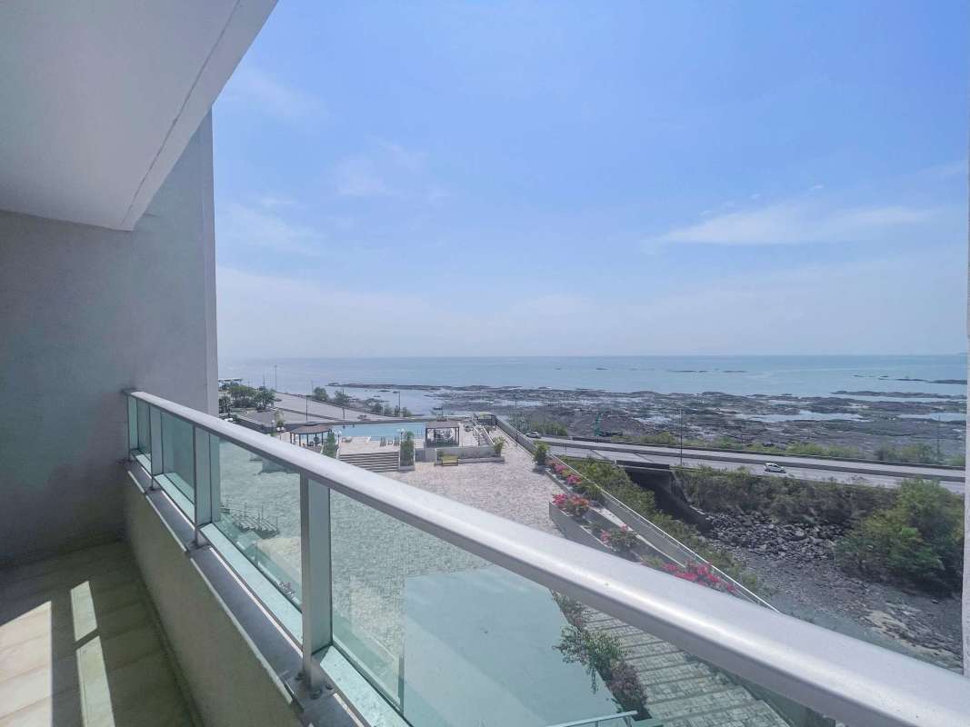 Wood cabinetry kitchen with granite counters and natural light, San Francisco Panama apartment