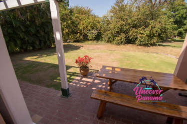 Covered patio area with seating tropical garden townhouse Costa Blanca Golf Villas Panama