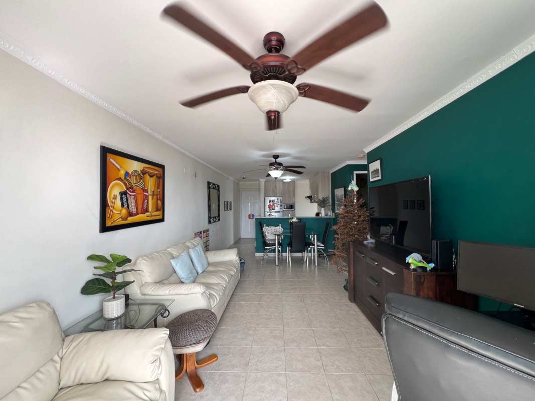 Open concept modern kitchen with granite counter and appliances at PH Vía España Carrasquilla