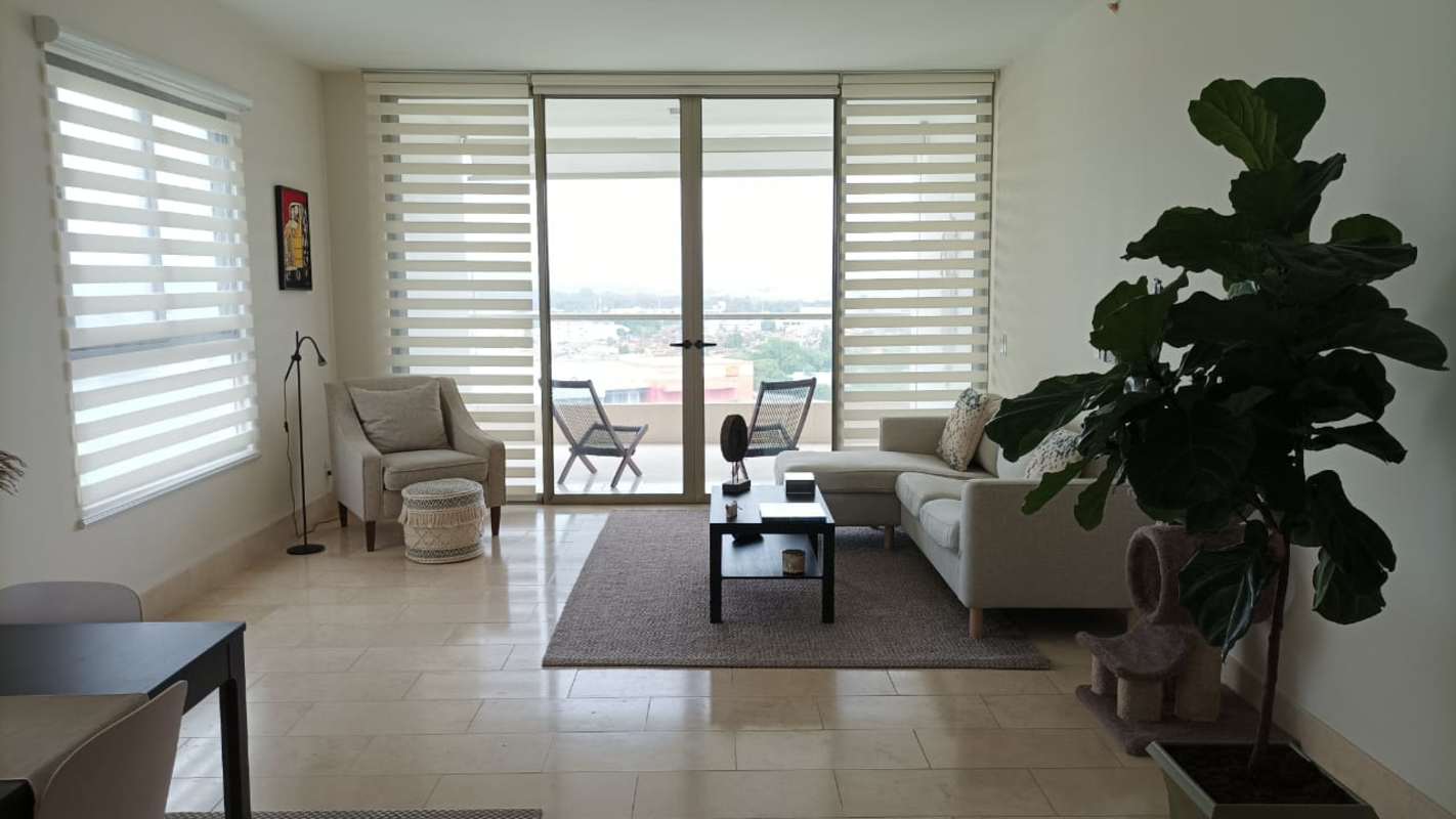 Spacious living room with marble floors and large window views at PH Greenview Santa Maria Panama