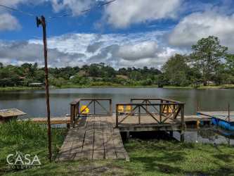 Rustic wooden dock at farm pond on land border Panama Costa Rica Río Sereno