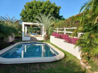 Private gated house with pool, lush tropical gardens, covered terrace in Club Ecuestre Coronado Panama