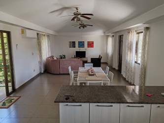 Spacious bedroom with large windows, closet, garden views in Coronado rental home