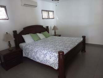 Covered terrace gazebo by private pool surrounded by gardens at Club Ecuestre Coronado