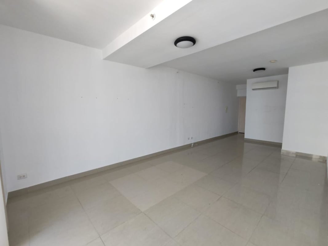 Rooftop swimming pool area with sun loungers and panoramic city views PH Rainbow Tower Panama City