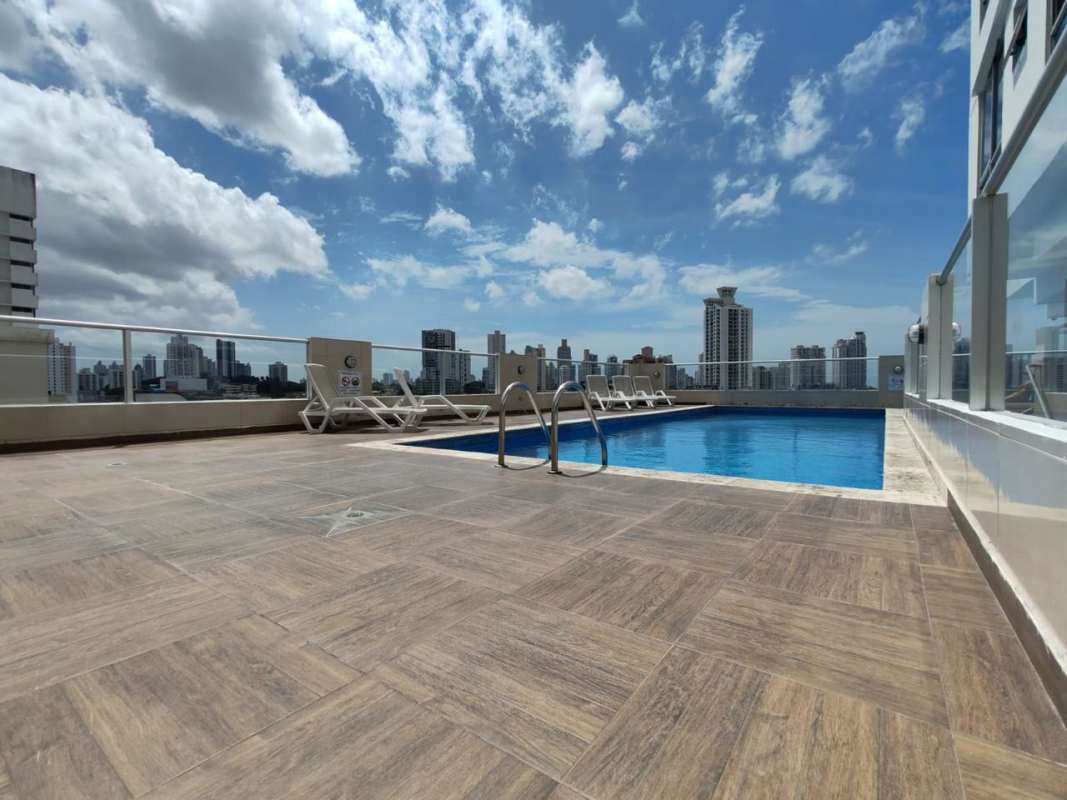 Outdoor playground with swings slides and safety turf in PH Rainbow Tower El Carmen Panama