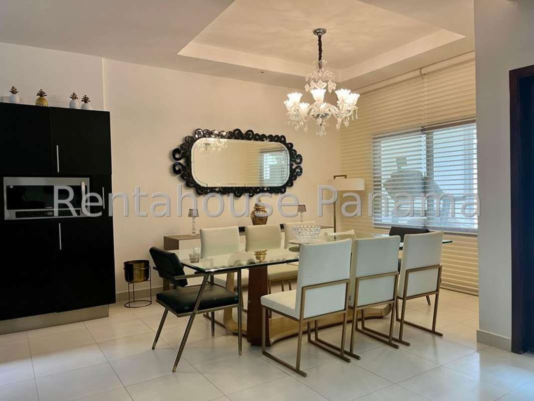 Modern kitchen with granite counters, stainless appliances, island in Sunset Coast Costa Sur Panama