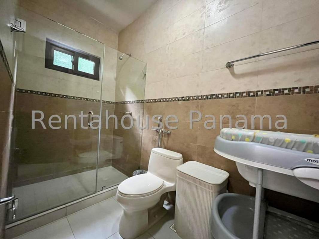 Furnished dining room glass table modern decor chandelier in Sunset Coast Costa Sur Panama