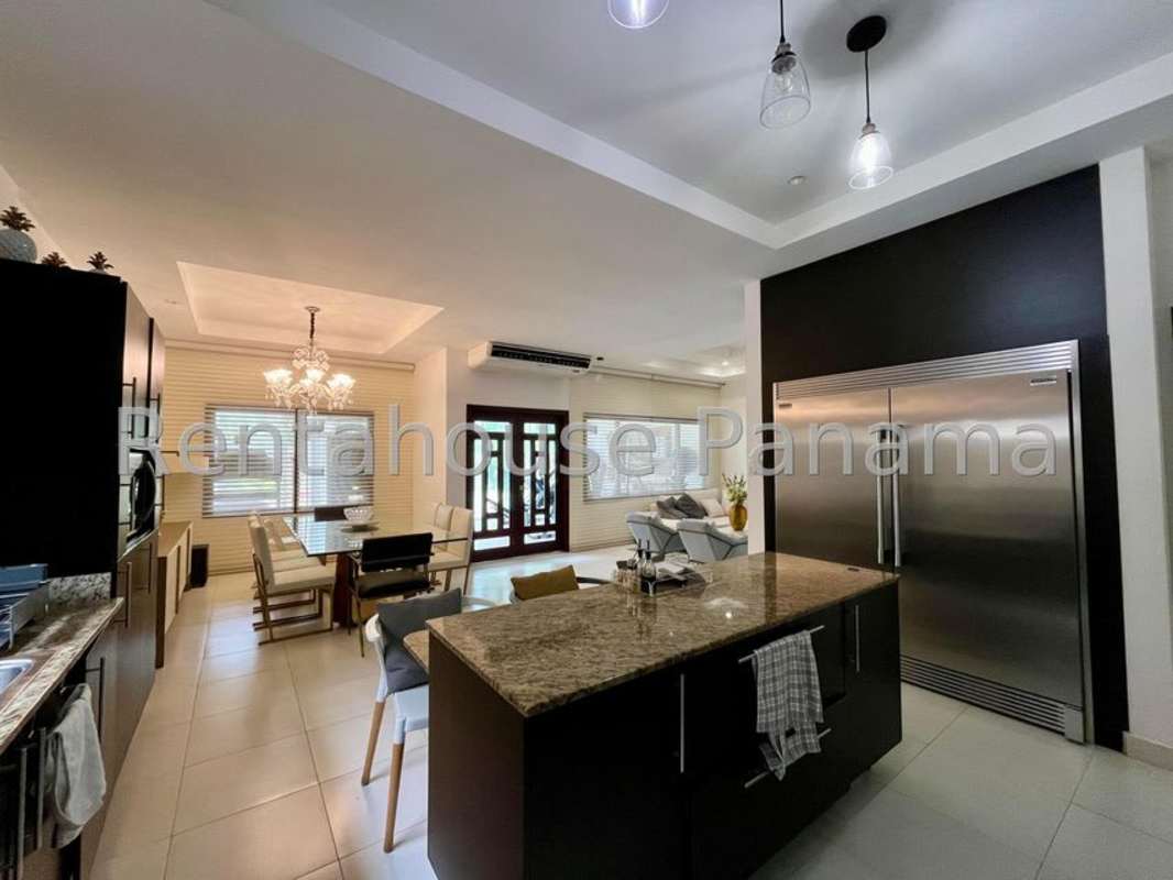 Spacious master bedroom with large windows, king bed, walk-in closet in Sunset Coast Panama