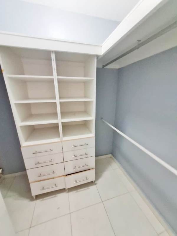 Spacious bedroom with wardrobes, ceiling fan, and tiled floors in PH Terrazas del Pacífico, San Francisco