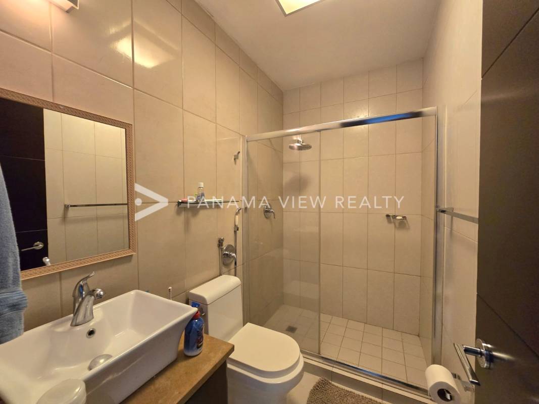 Modern bathroom with granite vanity, glass shower in PH Titanium Costa del Este Panama