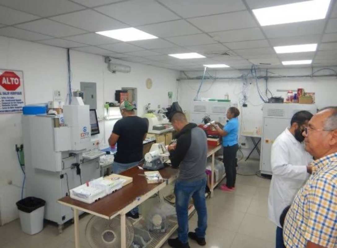 Industrial workspace with scientific equipment and bright fluorescent lighting in commercial building