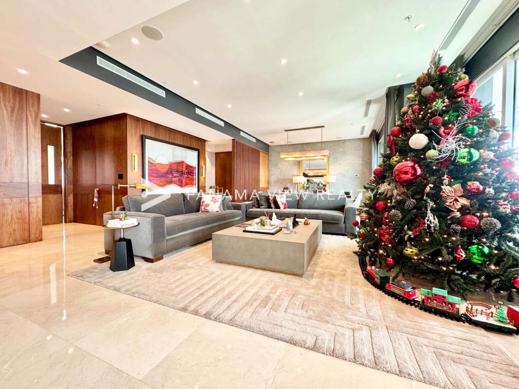 Elegant dining area connected to spacious living room with marble floors in PH Aria Panama