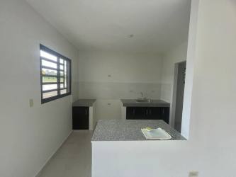 Bright living room with sliding glass doors and tile floors Los Algarrobos house Panama