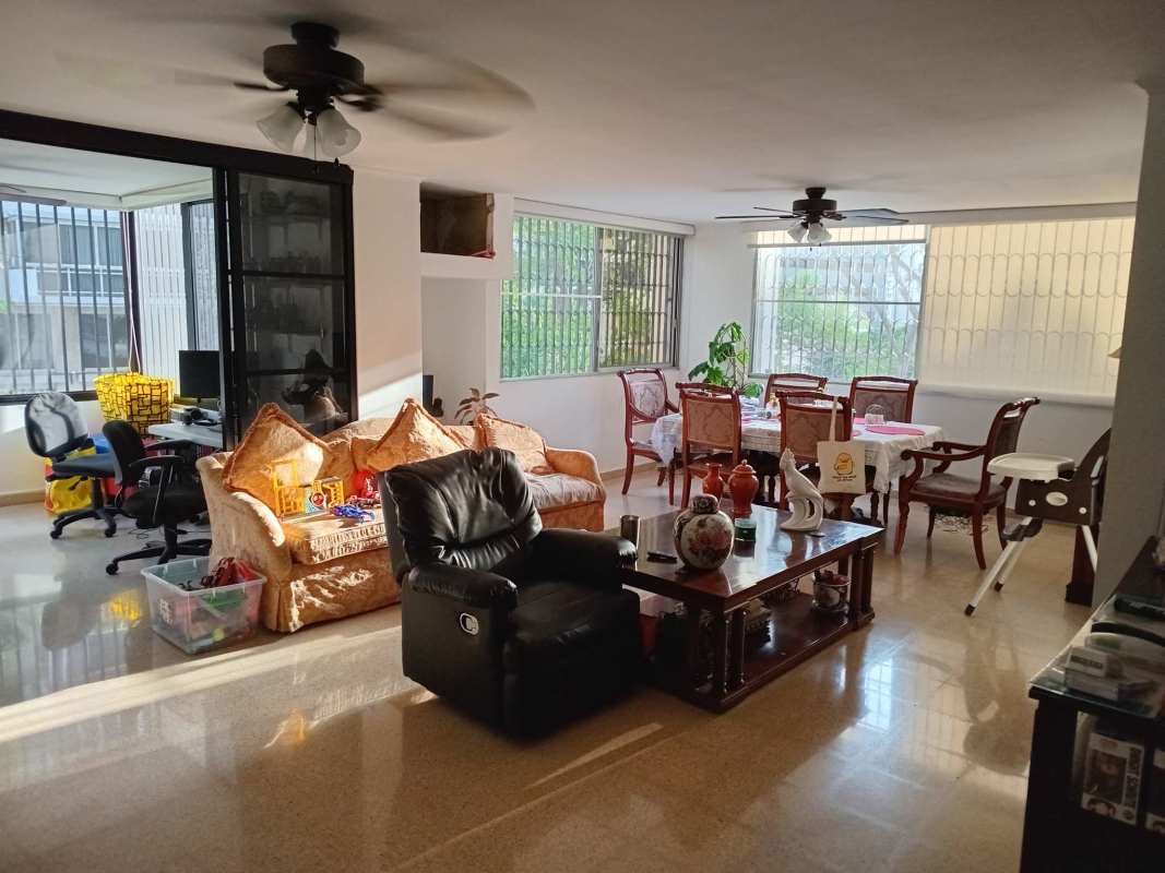 Spacious bright living dining area with large windows ceiling fans workspace PH La Joya 
