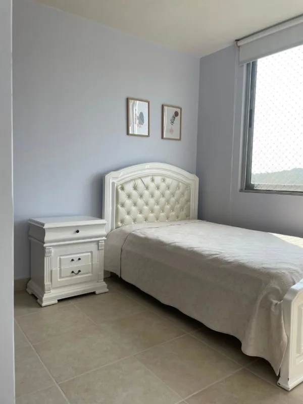 Furnished bedroom with large window in Clayton Panama