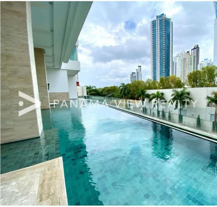 Infinity pool at PH Aria with views of Costa del Este oceanfront and skyline in Panama City