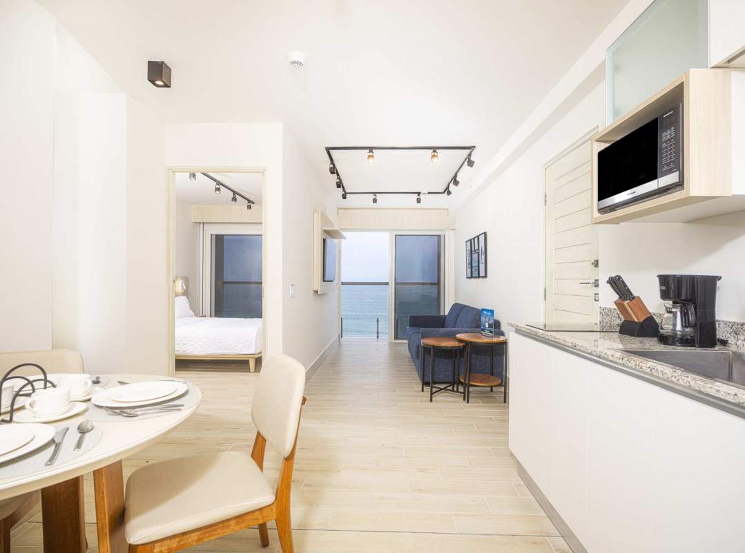 Modern apartment with ocean view, living dining area Surfside Playa Caracol