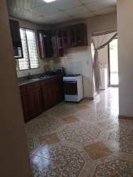 Second bedroom with double bed, closet, tiled floor and window Las Veraneras Santiago Panama