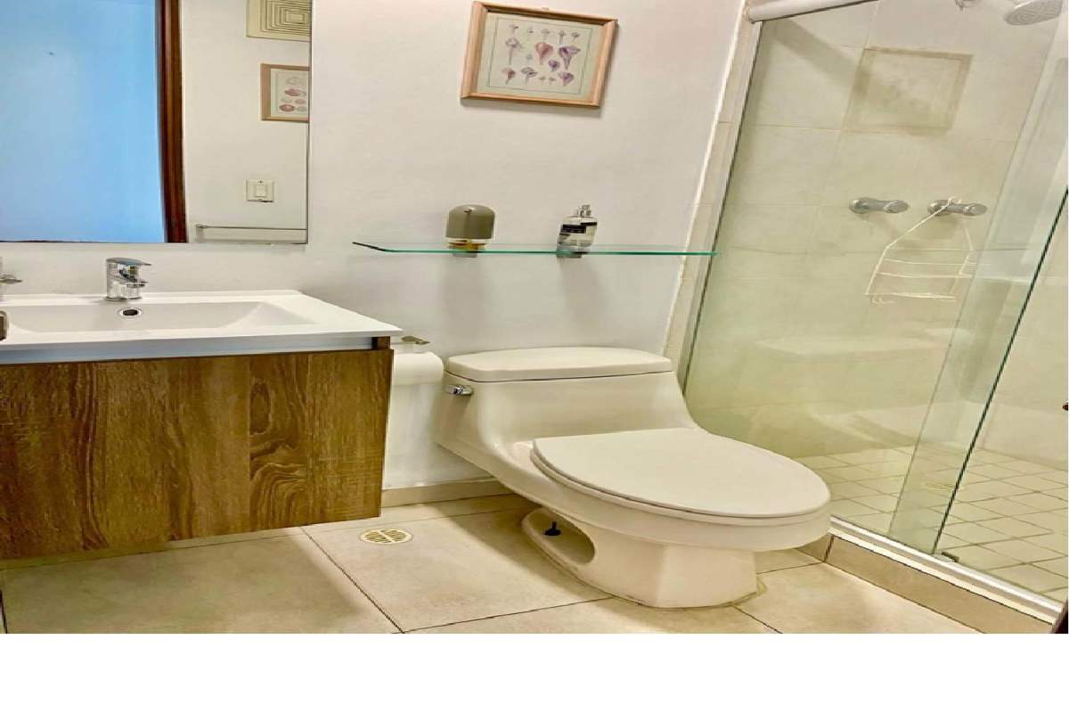 Modern bathroom with glass shower and vanity PH Terrawind Panama City