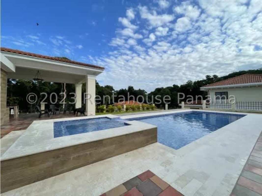 Spacious modern kitchen with island and wood cabinetry in Clayton luxury house