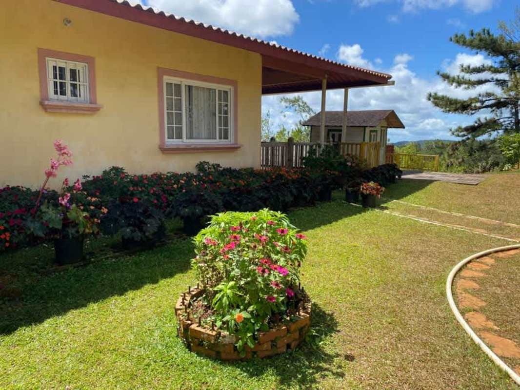 Rustic one-story mountain home with stone driveway on Cerro Azul estate land Panama