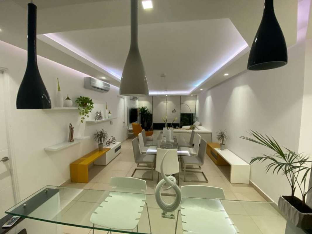 Bright open living dining room with panoramic windows and ocean views PH Destiny Tower Panama