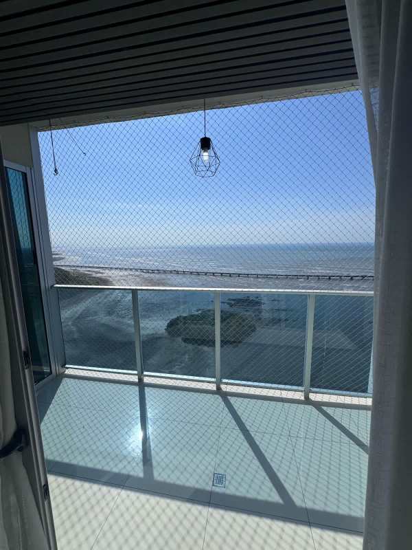 Bathroom with glass shower, ocean view window, white vanity and black fixtures in Nautica Tower Panama
