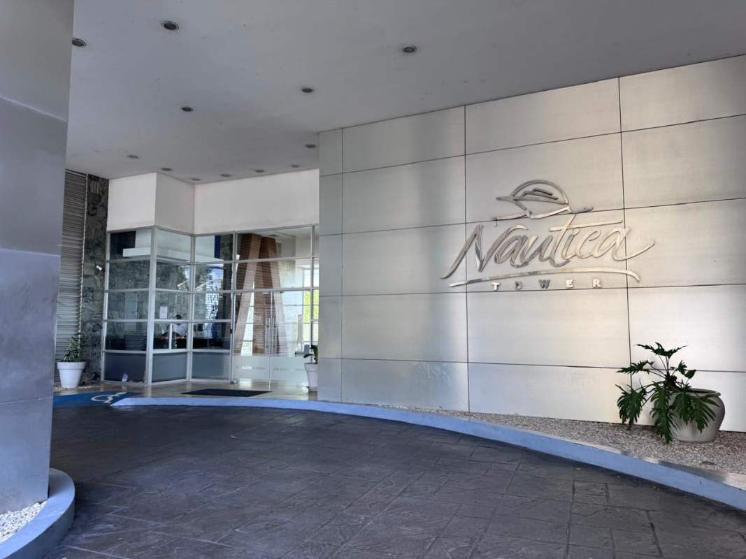 Covered infinity pool with lounge chairs and ocean backdrop at Nautica Tower Coco del Mar Panama