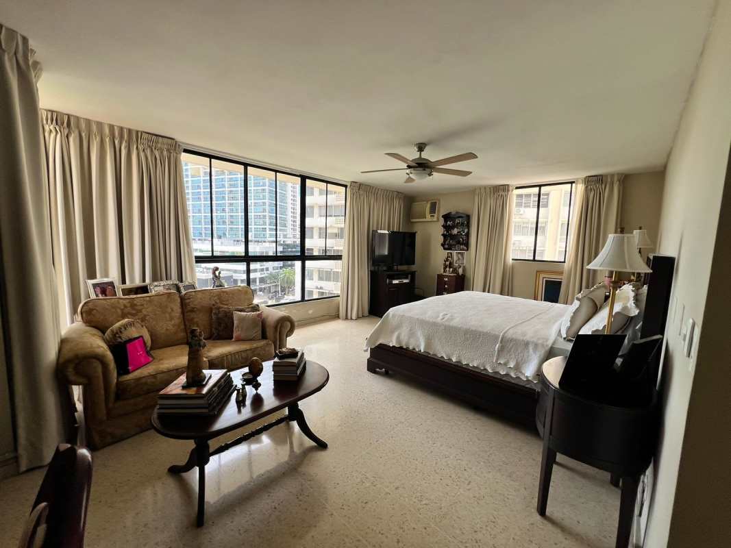 Spacious master bedroom ocean view windows ceiling fan Marbella Panama apartment