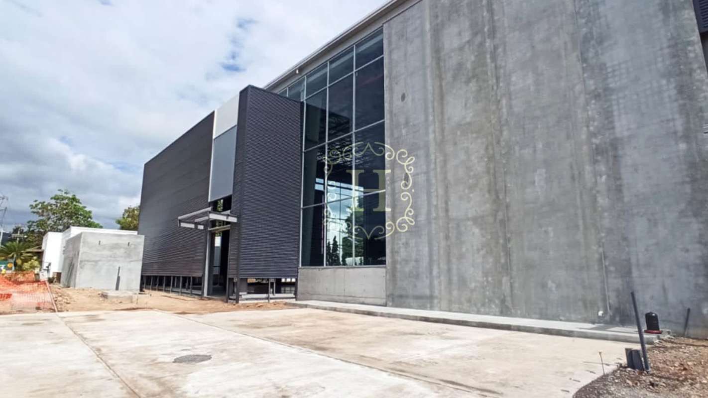 Modern industrial building office entrance with large windows Parque Logístico Tocumen Panama