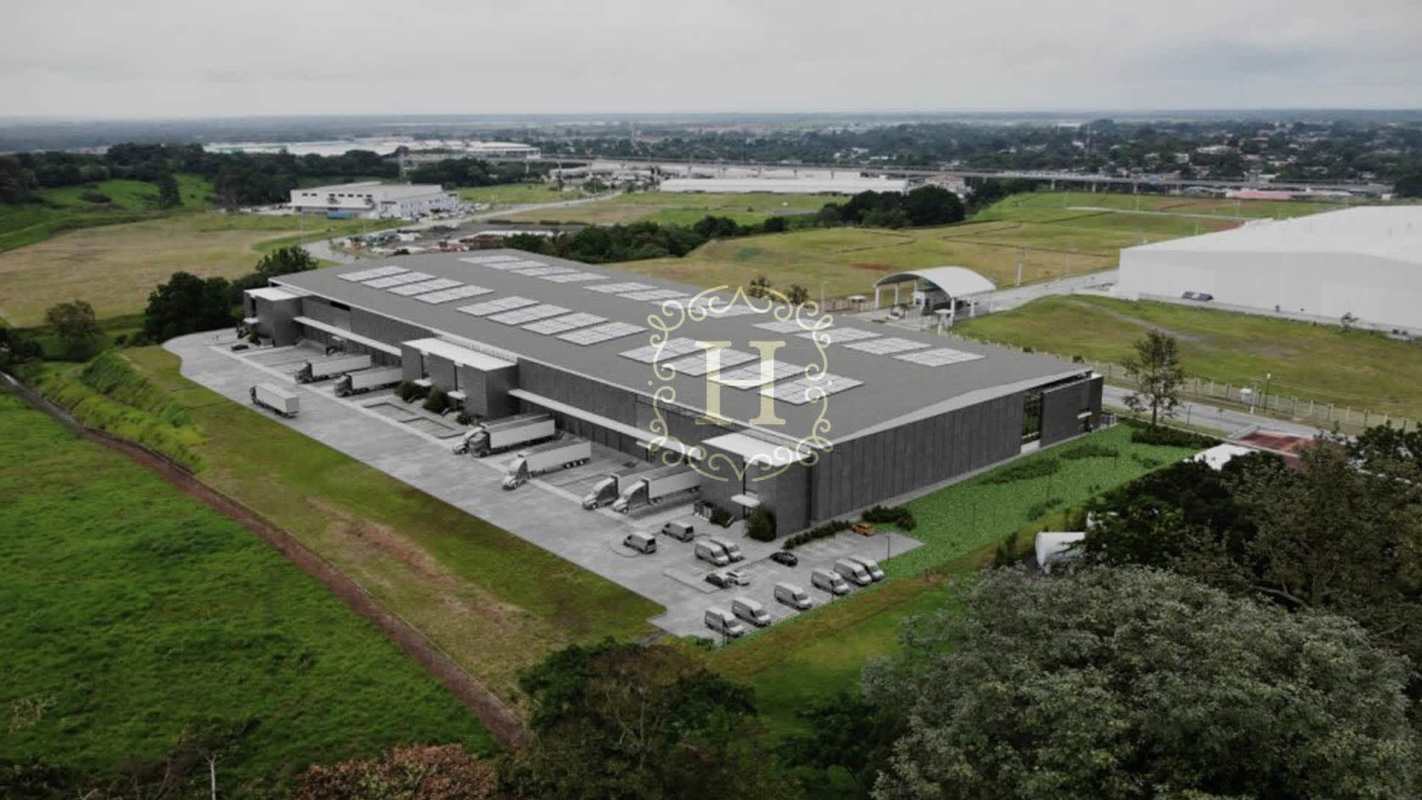 Aerial view of Parque Logístico Tocumen showing warehouses and container truck bays in Panama City