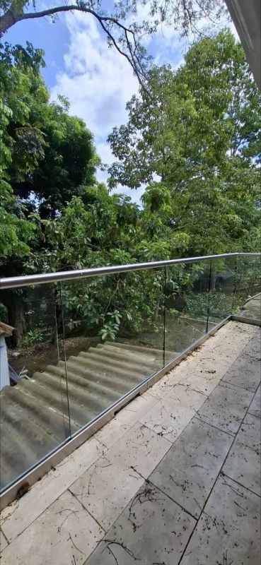 Private balcony with glass railing overlooking gardens Curundu Heights near Albrook Panama