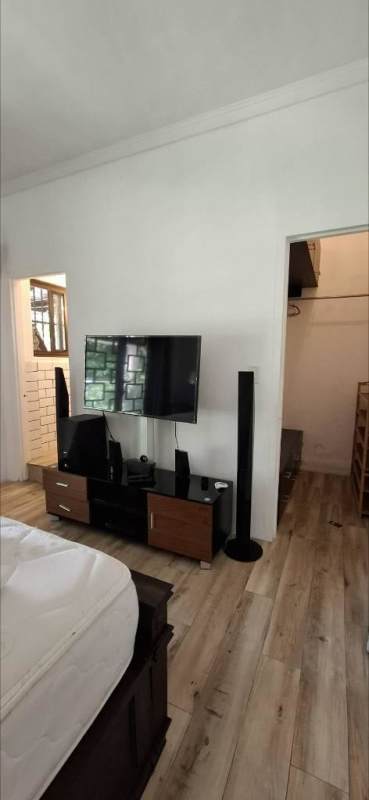 Bedroom area with TV media stand speakers wood flooring Curundu Heights Panama