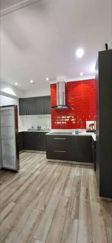 Open refrigerator dark kitchen cabinets red backsplash Curundu Heights Panama City