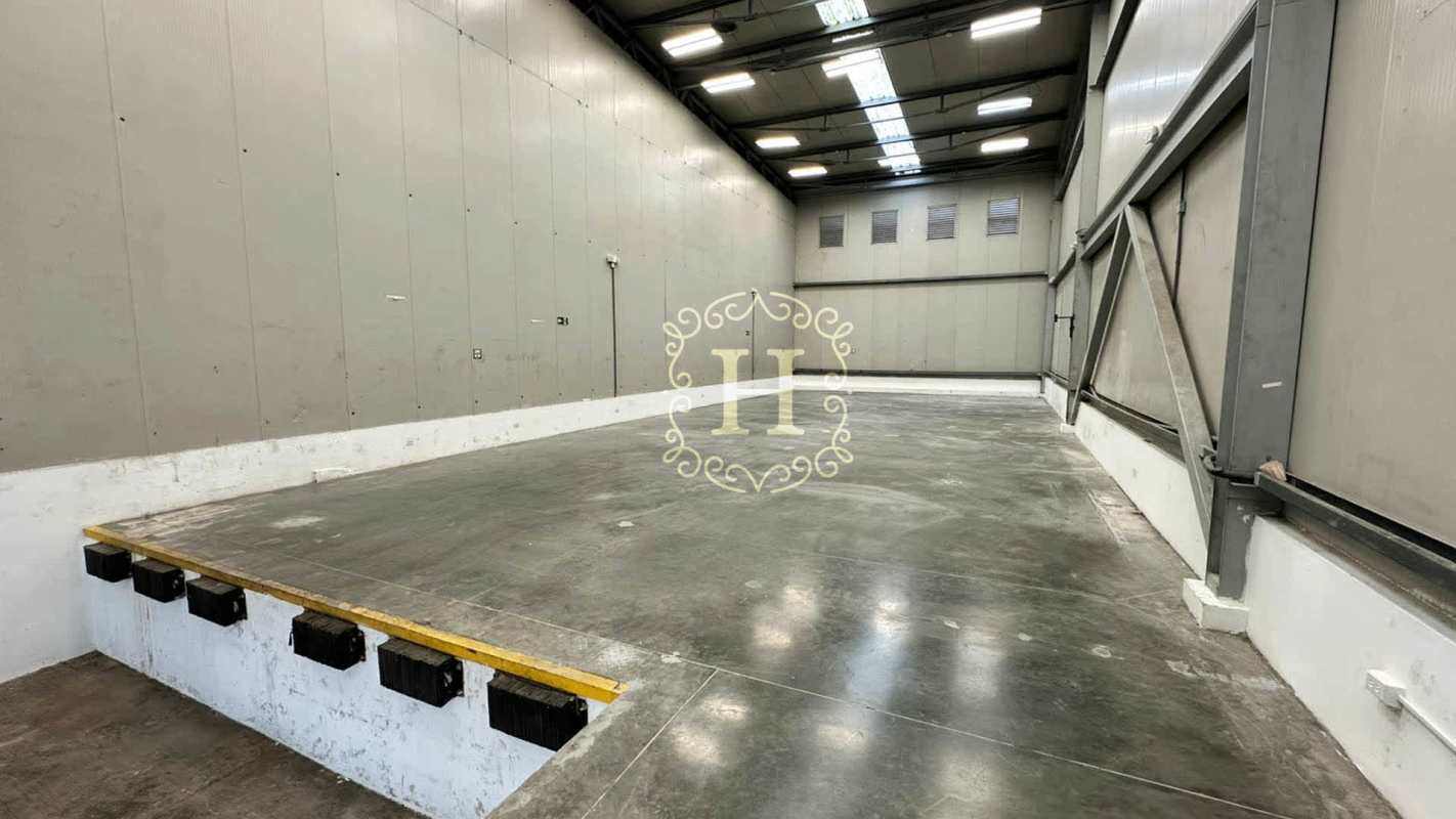 Warehouse loading dock area with high ceiling, container truck access at Airport Commercial Park III